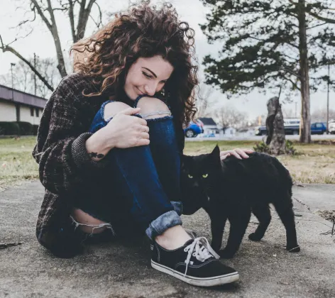 woman petting cat